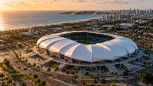 Vista aérea de estádio moderno com cobertura ondulada inspirada em dunas, em Natal